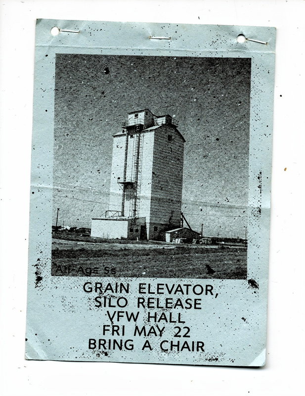 Flyer on blue paper: a halftone photo of a grain elevator under a big sky, with lettering for Grain Elevator’s Silo release at the VFW Hall, Friday May 22, bring a chair.