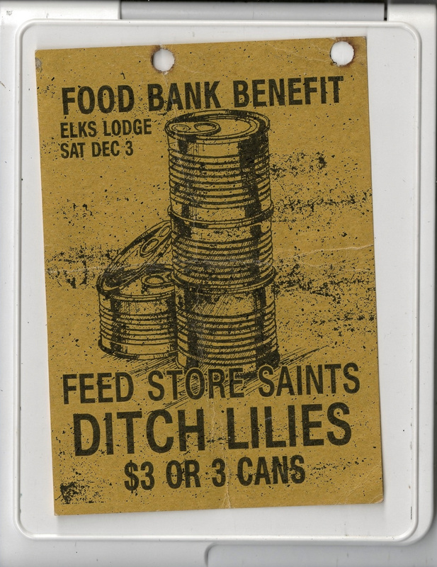 Flyer on yellow paper: a stack of tin cans and lettering for a food bank benefit at the Elks Lodge, Saturday December 3, with Feed Store Saints and Ditch Lilies, three dollars or three cans.