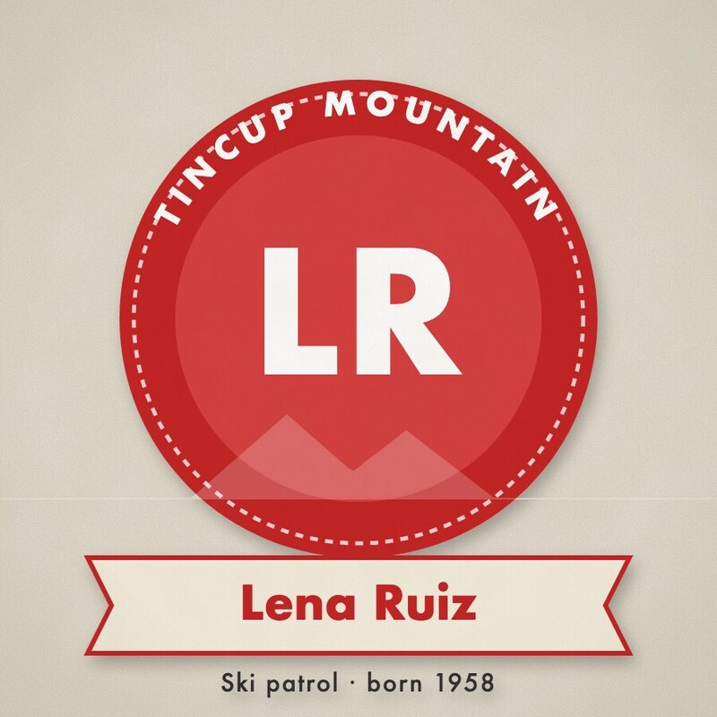 Red roundel badge with the initials LR and a ribbon reading Lena Ruiz, Ski patrol, born 1958.