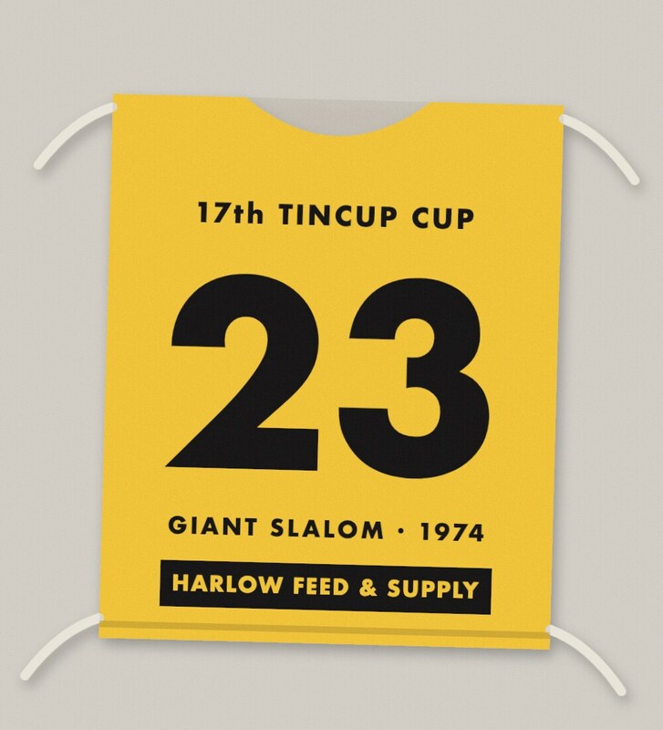 Yellow racing bib with a large black number 23, 17th Tincup Cup, Giant Slalom 1974, sponsor Harlow Feed & Supply.