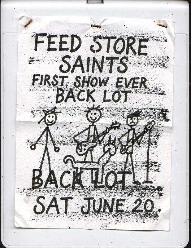 Ballpoint flyer: wobbly lettering for Feed Store Saints’ first show ever in the back lot, Saturday June 20, with a stick-figure band and a dog.