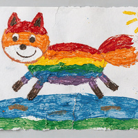 Tempera painting of a smiling fox striped red, orange, yellow, green, blue and purple, leaping over a blue puddle on a strip of green grass, with a yellow sun in the corner.