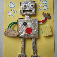 Collage of a foil-covered cardboard robot on yellow poster board with bottle-cap eyes, real buttons including a big red one, pipe-cleaner arms holding a plate and sponge, and drawn bubbles.